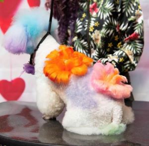 Creative grooming example featuring bold flower detail.